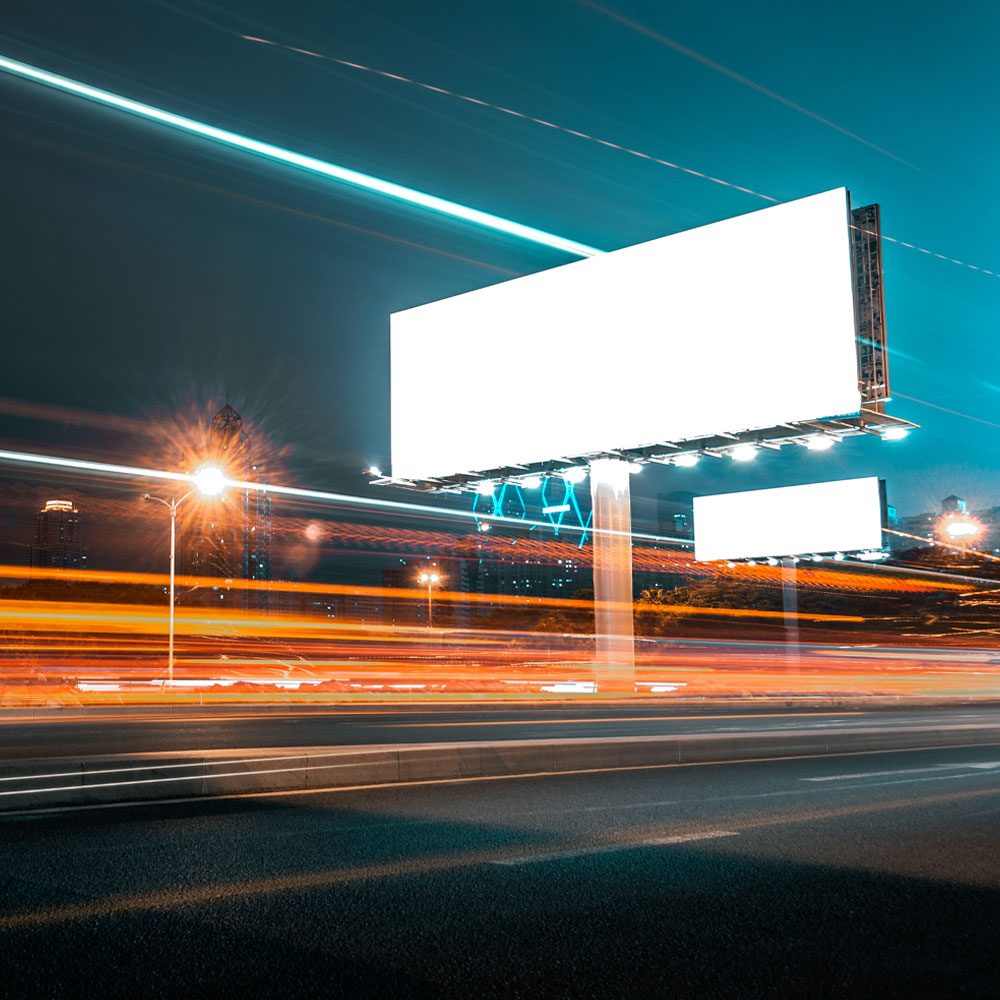 Billboard by a highway at night