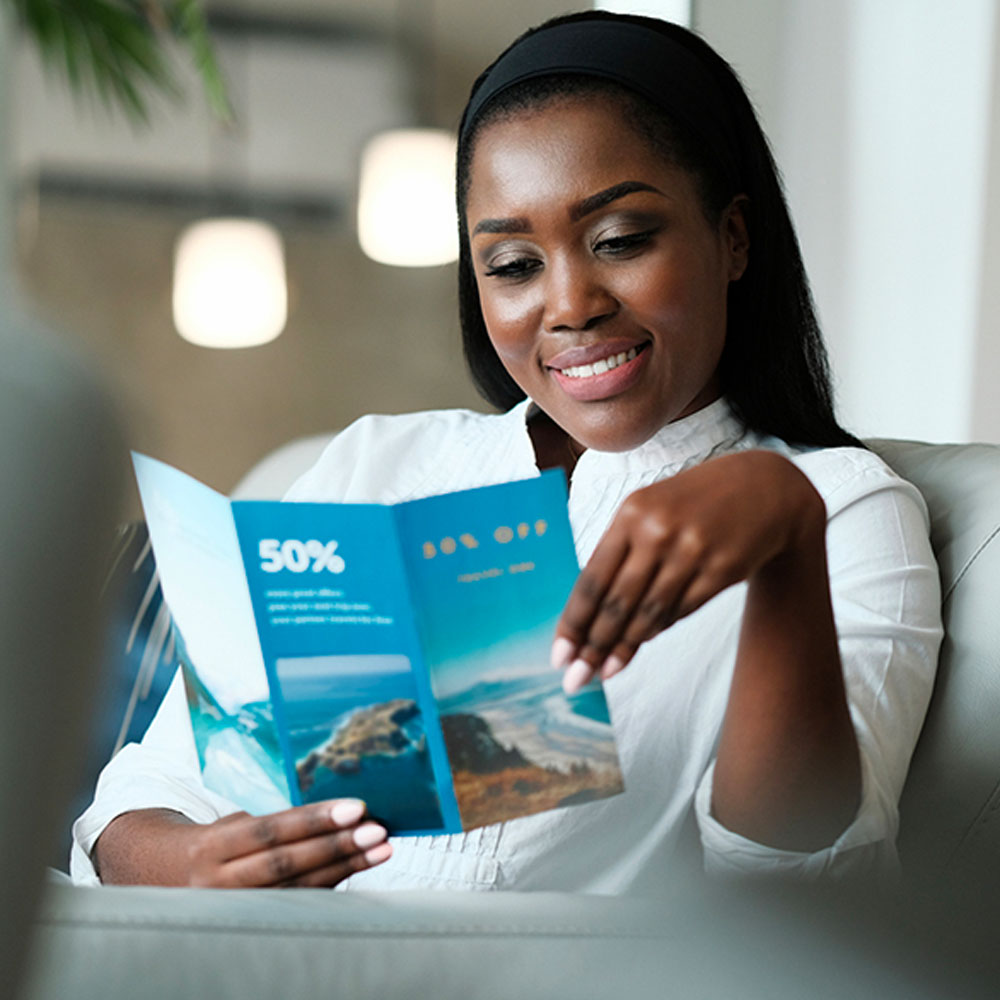 A woman reads an advertising flier
